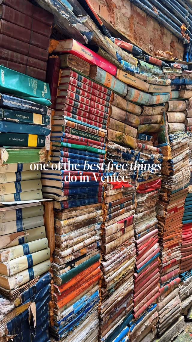 This bookshop has genuinely ruined all other bookshops for me 📚🇮🇹

This is Libreria Acqua Alta and it’s often called one of the most beautiful bookstores in the world and the second you step inside, you completely understand why. It doesn’t feel like a shop, it feels like you’ve stumbled into some hidden, chaotic treasure chest that just happens to be filled with books. Every corner is stacked high with novels, art books, maps and vintage finds, piled in a way that somehow looks messy and magical at the same time.

One of the most unique things about it is how the books are stored. Because Venice floods so often you’ll spot them tucked inside bathtubs, waterproof bins and even gondolas to keep them safe from rising water.

At the back of the shop there’s a staircase made entirely from old, damaged books which has become one of the most popular photo spots. Once you climb to the top, you get the cutest view over the canal, which somehow makes the whole place feel even more special. It’s one of those places that feels completely unique and unlike anywhere else you’ve visited.

It’s completely free to enter, but just a warning you probably won’t leave empty handed. I told myself I was “just looking” and still ended up buying some Venice themed bookmarks because they were too cute and such a different souvenir.

I’ve also done a free travel guide to Venice including where to stay, things to do + where to eat! Just comment LINK below and I’ll send it straight to you 💌

things to do in Venice, Venice bookshop, Venice things to do, Venice travel, free thing to do in Venice, bookshop in Venice, Venice travel, Venice travel tips